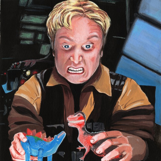 A blonde man has a fearsome expression as he plays with two plastic dinosaur figurines. A spaceship interior is in the background.